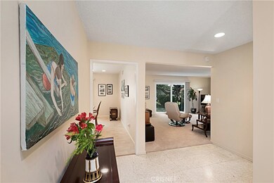 Formal Foyer entry opens to view of back yard through living room and dining room