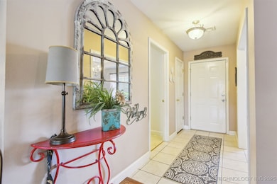 Lovely light and bright entry. Laundry and formal