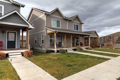 View of front of home with a front lawn and a porch