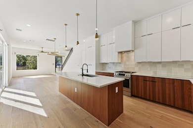 Kitchen with stainless steel range with gas stove