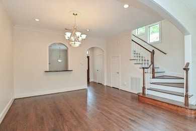 The majestic dining space has high a ceiling, a so