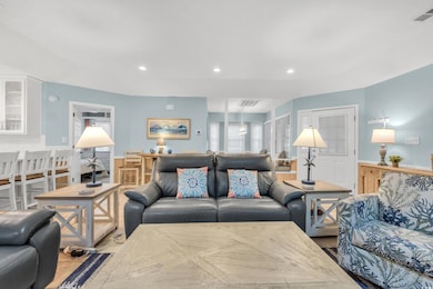 Living room with light hardwood / wood-style floor
