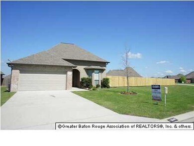 front view, large privacy fenced lot