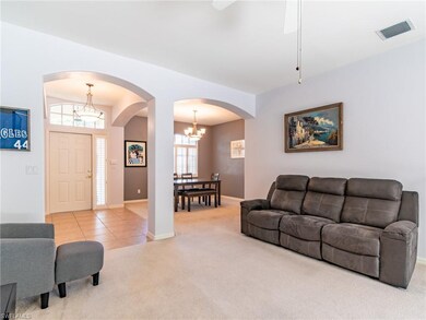 Entry way, living room and dining room in backgrou
