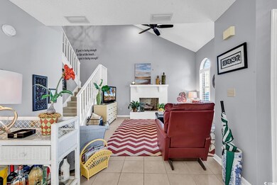 Tiled living room featuring a textured ceiling, ce
