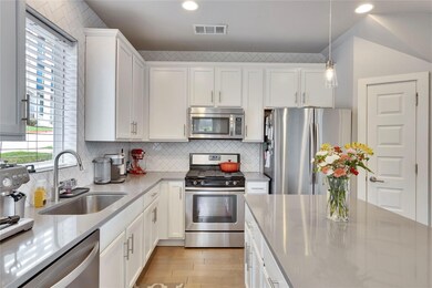 Kitchen with stainless steel appliances, visible 