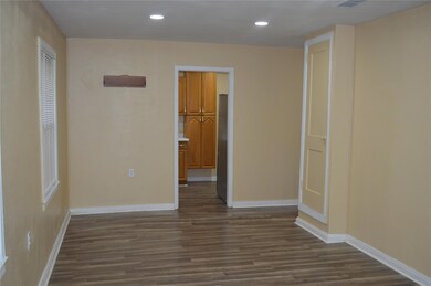Unfurnished room featuring dark hardwood / wood-st