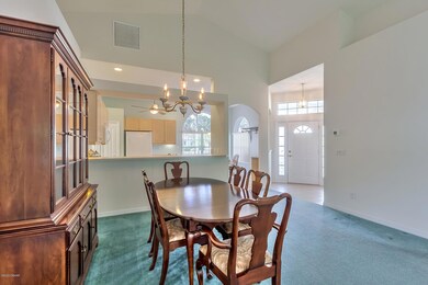 Dining Room View to Foyer & Kitchen