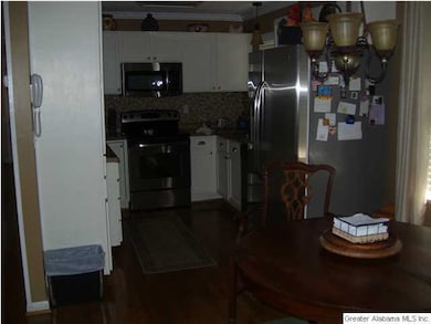 View into the stylish kitchen with tile backsplash