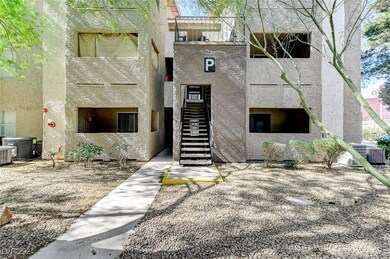 View of building exterior with central AC unit and