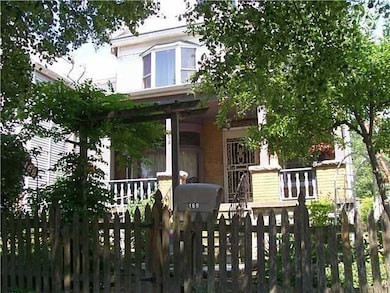 Exterior Front. Fenced front yard features a lush 