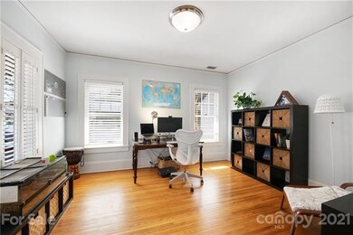 Front room, currently serving as an office, but co
