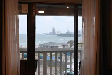 Entryway with a water view, plenty of natural light, and a view of city