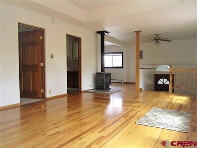 wood stove and dining area at end