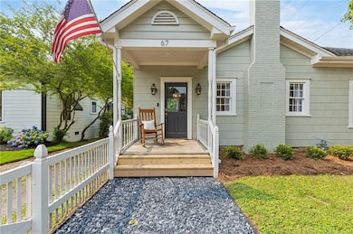 Front porch features new gas lanterns.
