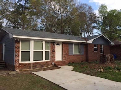 Single story home featuring crawl space and brick siding