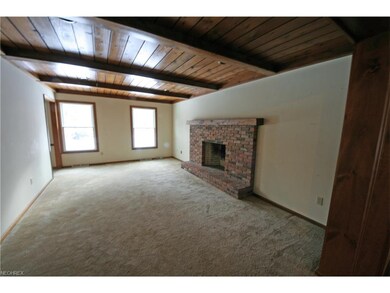 Family room with Fireplace. Beautiful wood beamed 