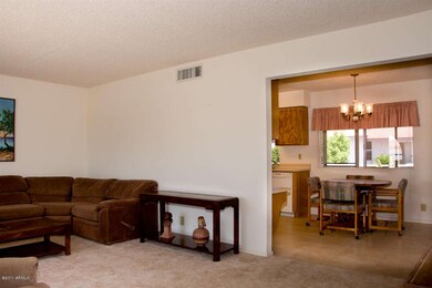 Living room flows into dining area.