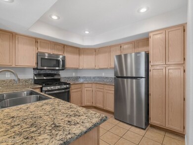 Kitchen with stainless steel appliances, light bro