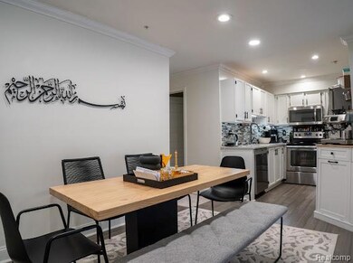 Dining area with crown molding, recessed lighting, and dark wood-type flooring