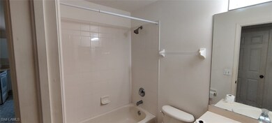 Full bathroom with vanity, toilet, and tiled showe