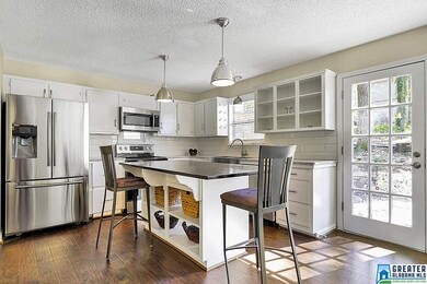 Granite, subway tile backsplash, stainless steel a