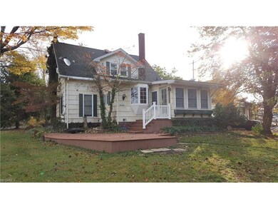 main entrance off back yard leading to sunroom the