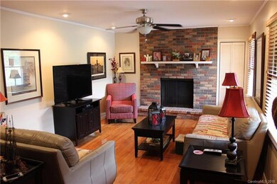 Living room with recessed lighting and solid oak f