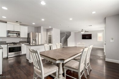 Dining area featuring recessed lighting, dark wood