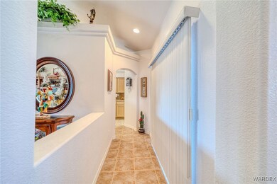 Corridor featuring light tile patterned floors