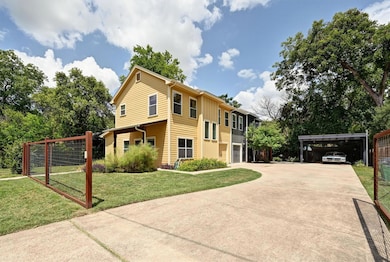 View of front of house featuring driveway, board 