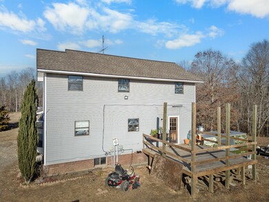 Large deck off the kitchen is perfect for hosting outdoor gatherings, and with a reinforced floor, could be finished out as a dining room!