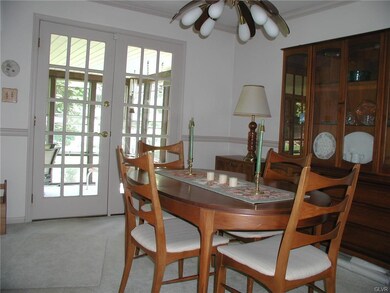 Dining room and doors leading to Florida/Sunroom..
