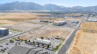Aerial view of a mountainous background and an industrial area
