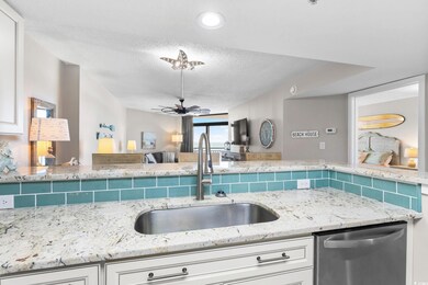 Kitchen featuring ceiling fan, dishwasher, a textu