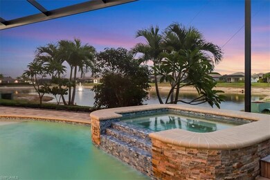 View of pool featuring an in-ground hot tub and a water view