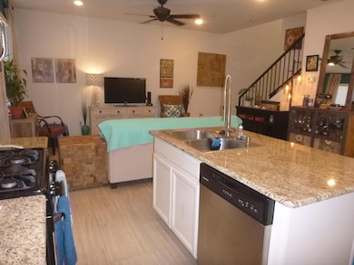 Kitchen featuring stainless steel dishwasher, cei
