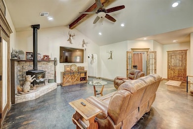 Living room with ceiling fan, lofted ceiling with 