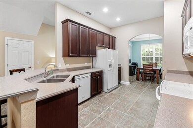 Kitchen leads into spacious dining room