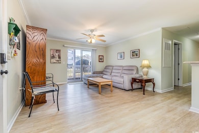 Living room with light hardwood / wood-style floor