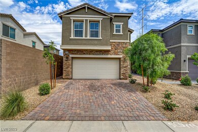 Pavers in driveway and stone frontage