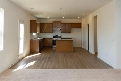 Kitchen with stainless steel electric range oven, 