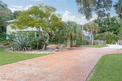 Front of home with wide stamped concrete driveway