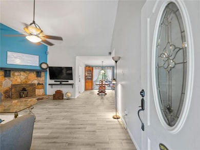 Entrance foyer featuring baseboards, light wood-st