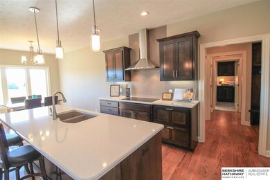 QUARTZ COUNTER TOPS, HUGE PANTRY, CUSTOM MAPLE CABINETS, CERAMIC TILE BACK SPLASH, THIS CUSTOM KITCHEN HAS IT ALL.