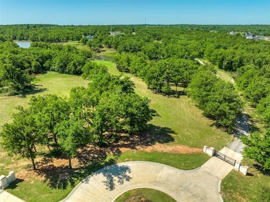Birds eye view of property featuring a view of tre