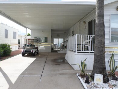 SPACIOUS CARPORT W/SHED