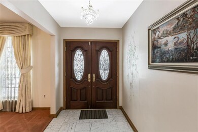 Double wood entry doors with leaded glass oval ins