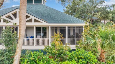 Rear view of house with a sunroom