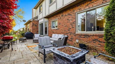 View of patio with an outdoor living space with a fire pit and a grill